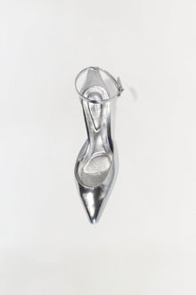 Silver metallic leather wedge shoe with ankle strap and pointed toe, shown from above.