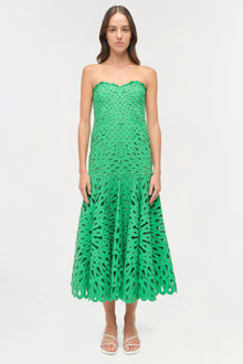 Green strapless midi dress with leaf-pattern cutout embroidery and scalloped hem.