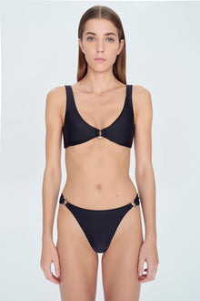 Black bikini bottom with side metal ring hardware details.