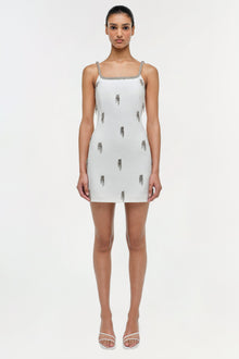 White mini dress with silver beaded straps and scattered embellished tassel details throughout.