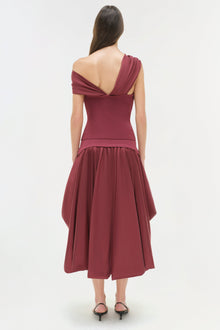 Burgundy off-shoulder top with draped neckline and fitted bodice, shown from back view on model.