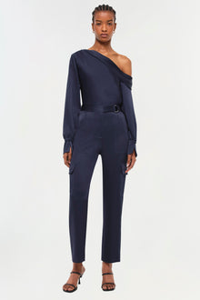 Navy cargo pants with high waist, belt detail, and side pockets.