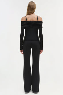 Black off-shoulder long sleeve top with ruched neckline and thin straps, shown from back view.