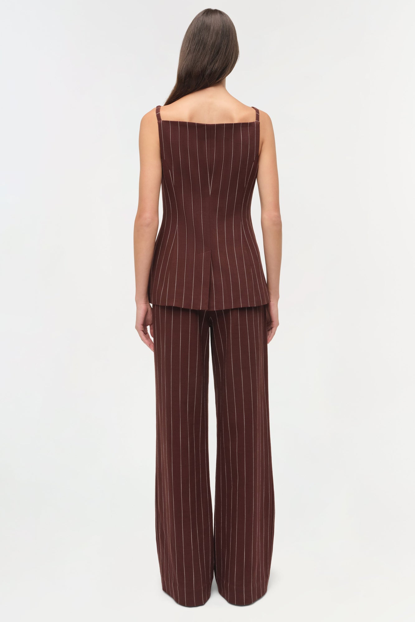 Brown pinstriped wide-leg suiting pants with matching sleeveless top, shown from back view.