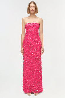 Hot pink strapless floor-length gown with sequin and beaded embellishments throughout.