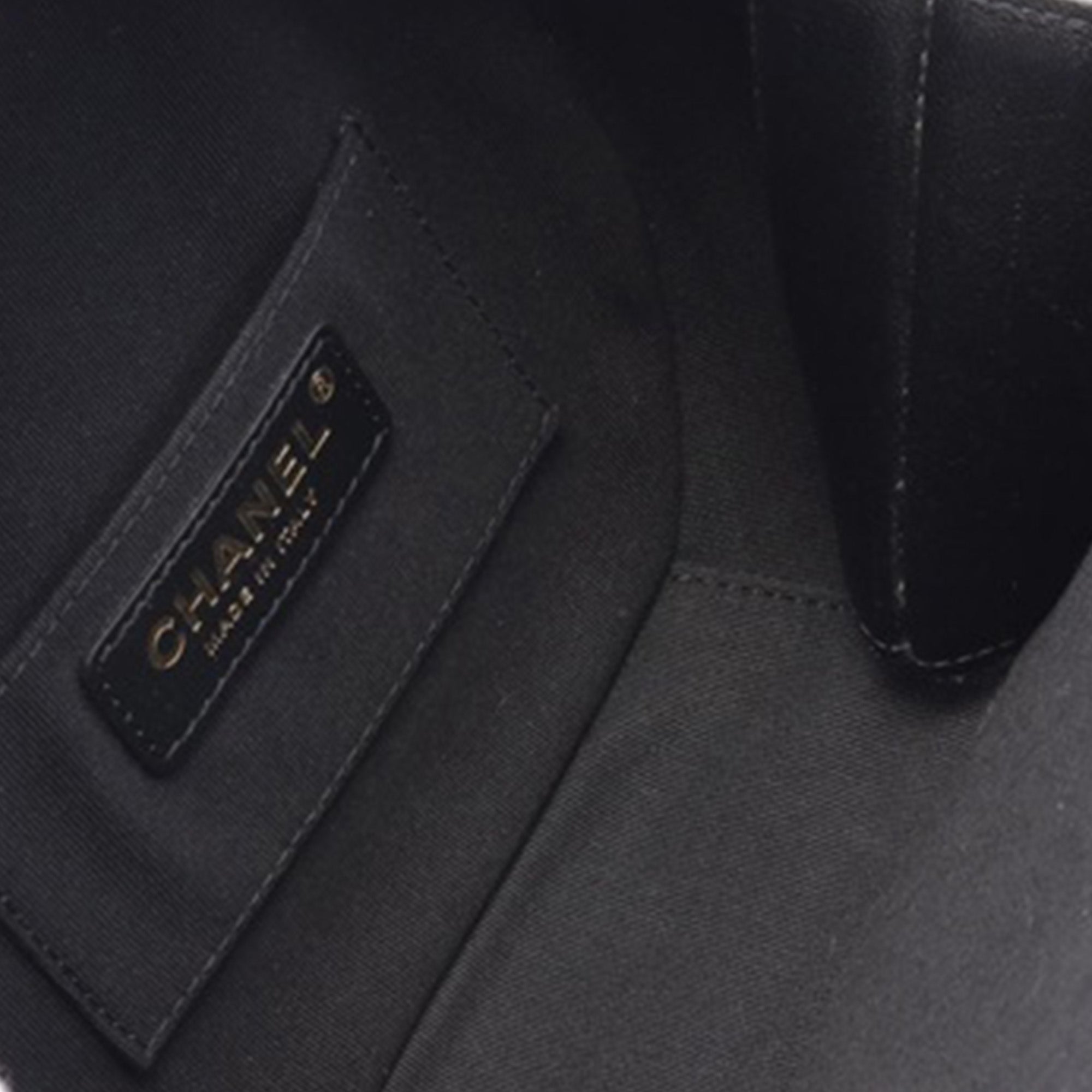 Chanel | Pre-Owned Quilted Lambskin Oval Logo Chain Top Handle Round Clutch on Chain | Black