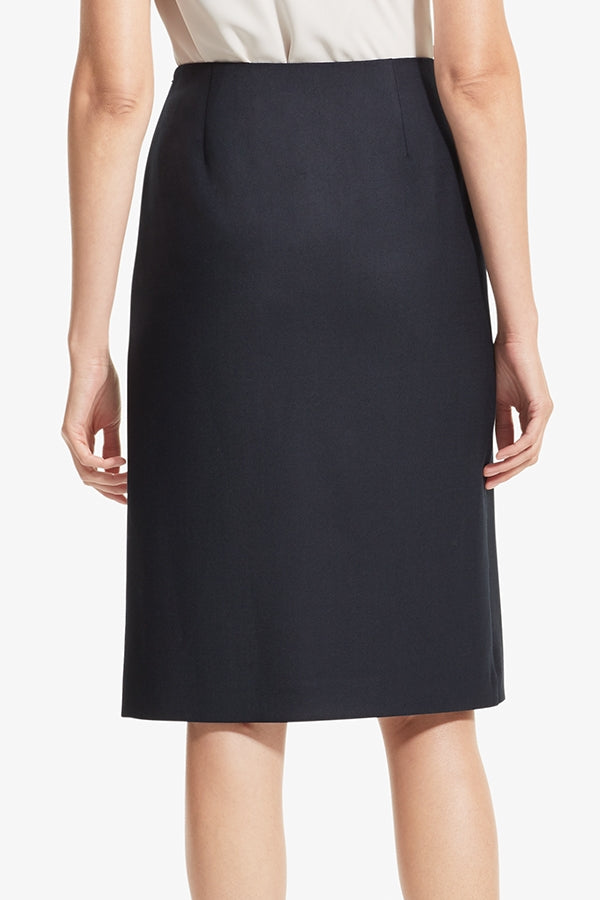 Back image of a woman standing wearing the Logan skirt sharkskin in Ink | Grid Hover | Exclude