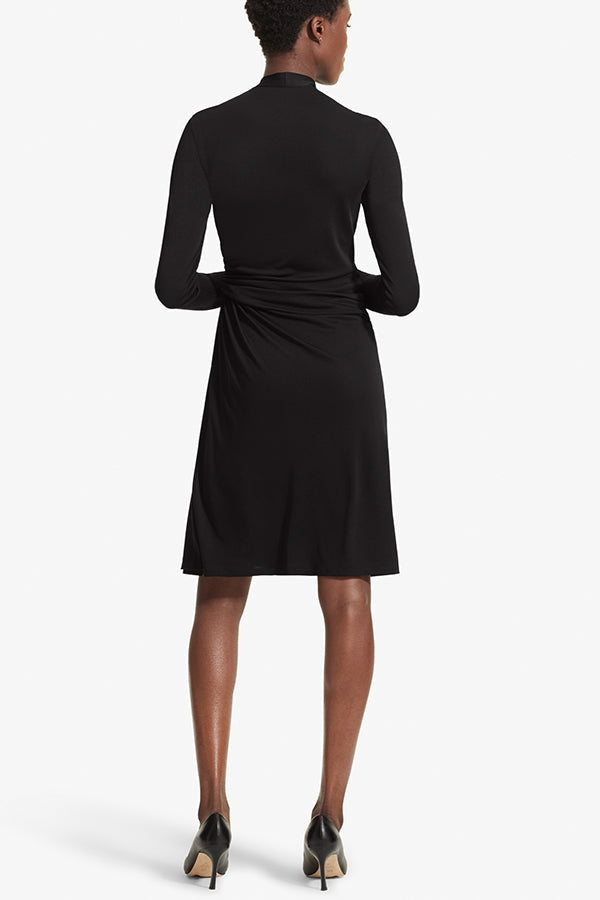 Back image of a woman standing wearing the Morgan dress in Black | Grid Hover | Exclude