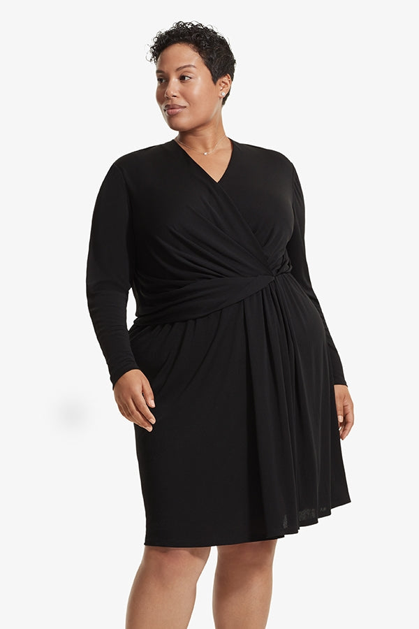 Front image of a woman standing wearing the Morgan dress in Black | Plus | Exclude