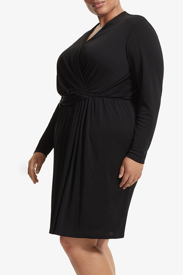 Side image of a woman standing wearing the Morgan dress in Black | Plus Hover | Exclude