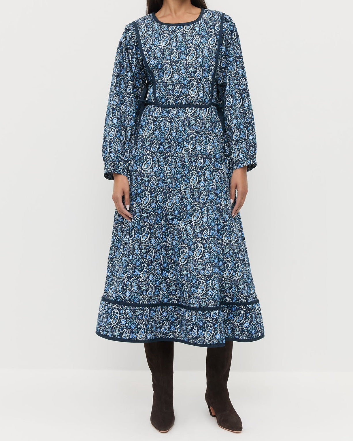 Ainsley Dress in quilted cotton with a blue paisley floral design and Marley Brown Suede Tall Boots.
