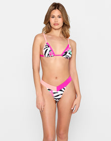 Model wearing the Alex Micro Tri Top and Naomi Micro Tango Bottom in zebra floral print with pink and coral trim, from the latest swimwear collection