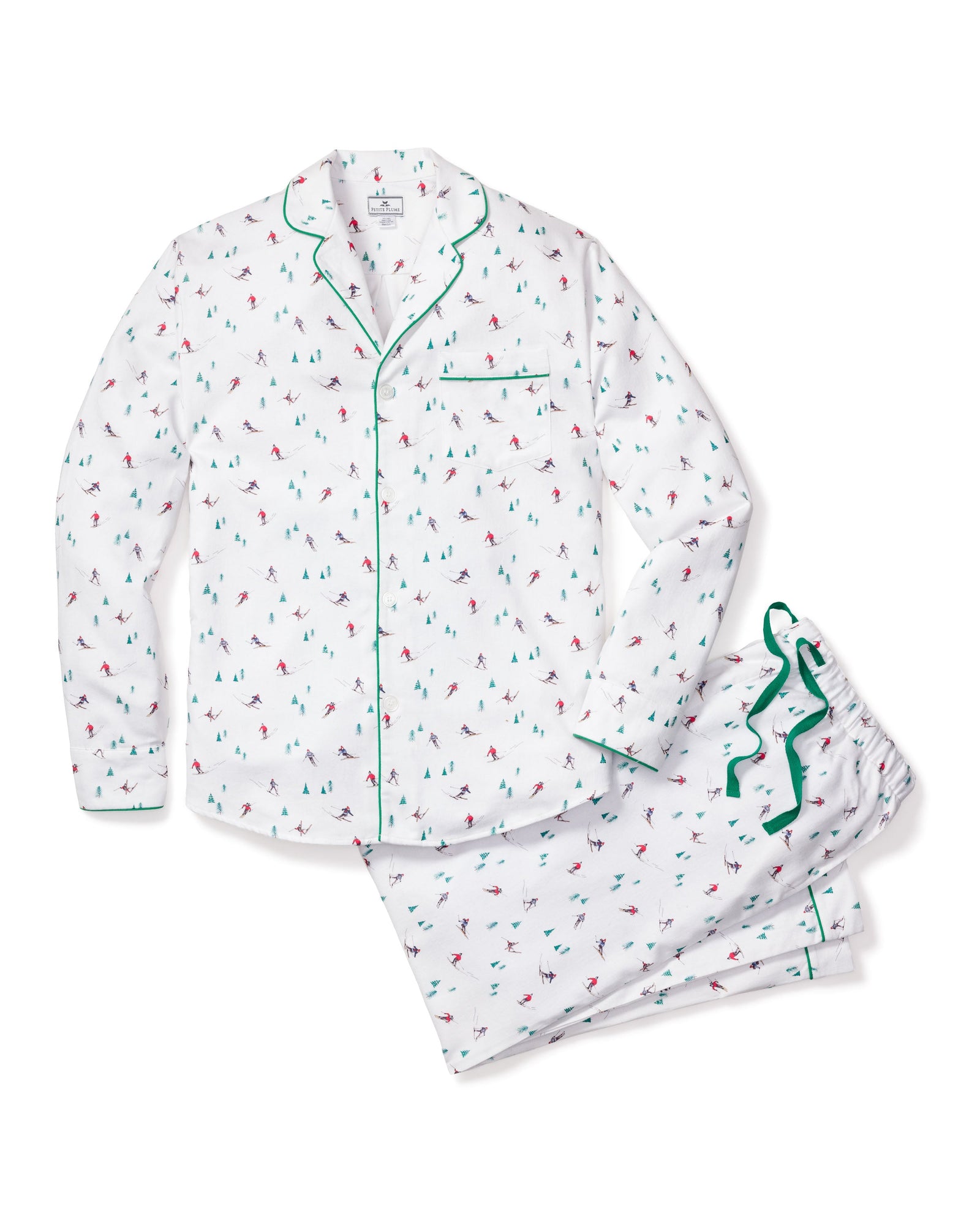 The Petite Plume Mens Flannel Pajama Set in Apres Ski is crafted from 100% cotton, showcasing a white fabric with green piping and a vibrant small sailboat pattern. It includes a pocketed button-up shirt and matching pants, offering comfort for a cozy nights sleep.