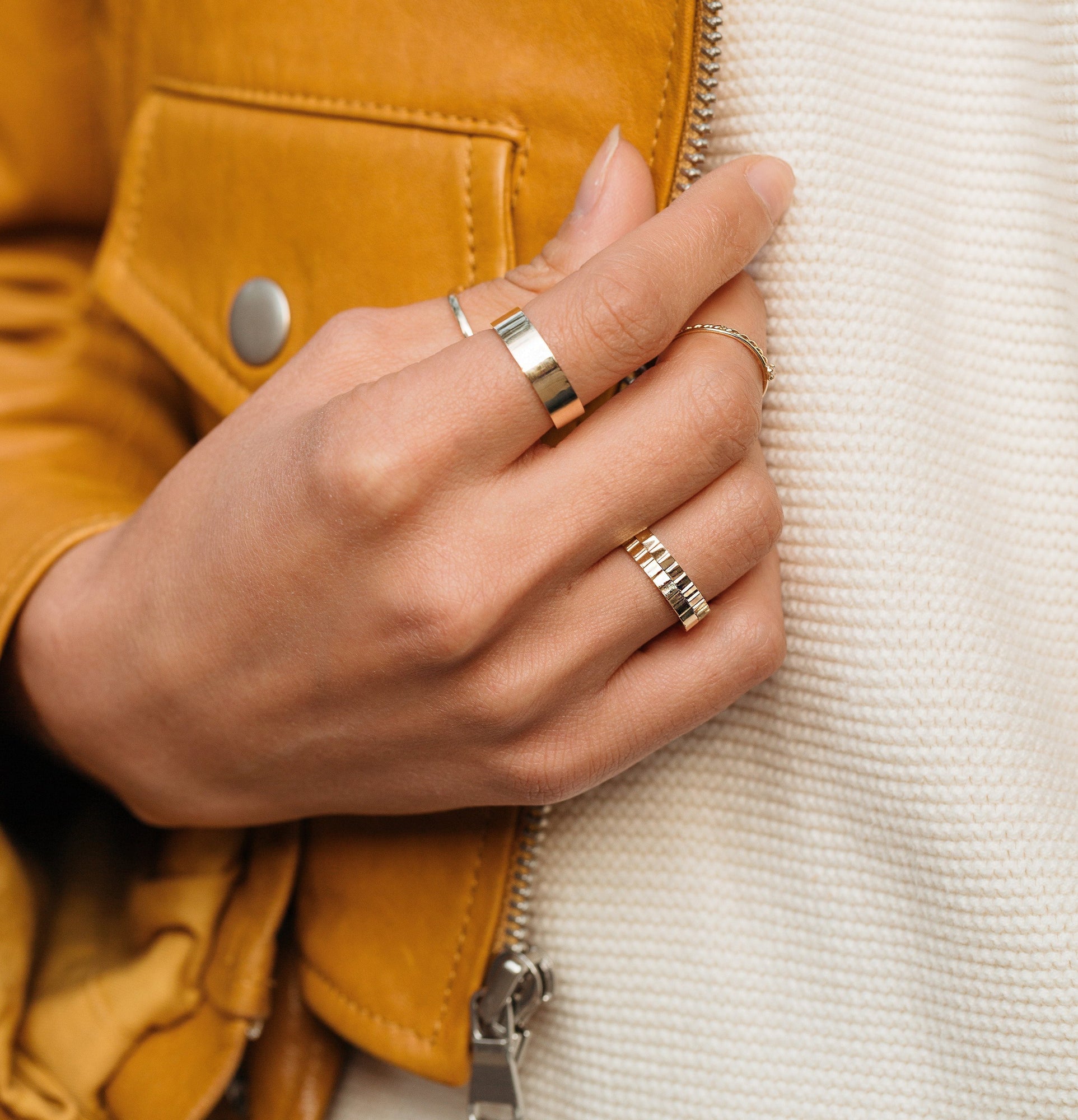 Lifestyle Mode. Close up of woman's hand with various rings.