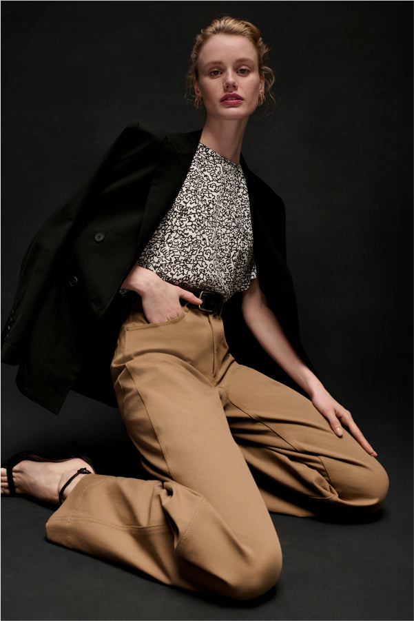 front image of a woman wearing the milo jean in saddle | Exclude