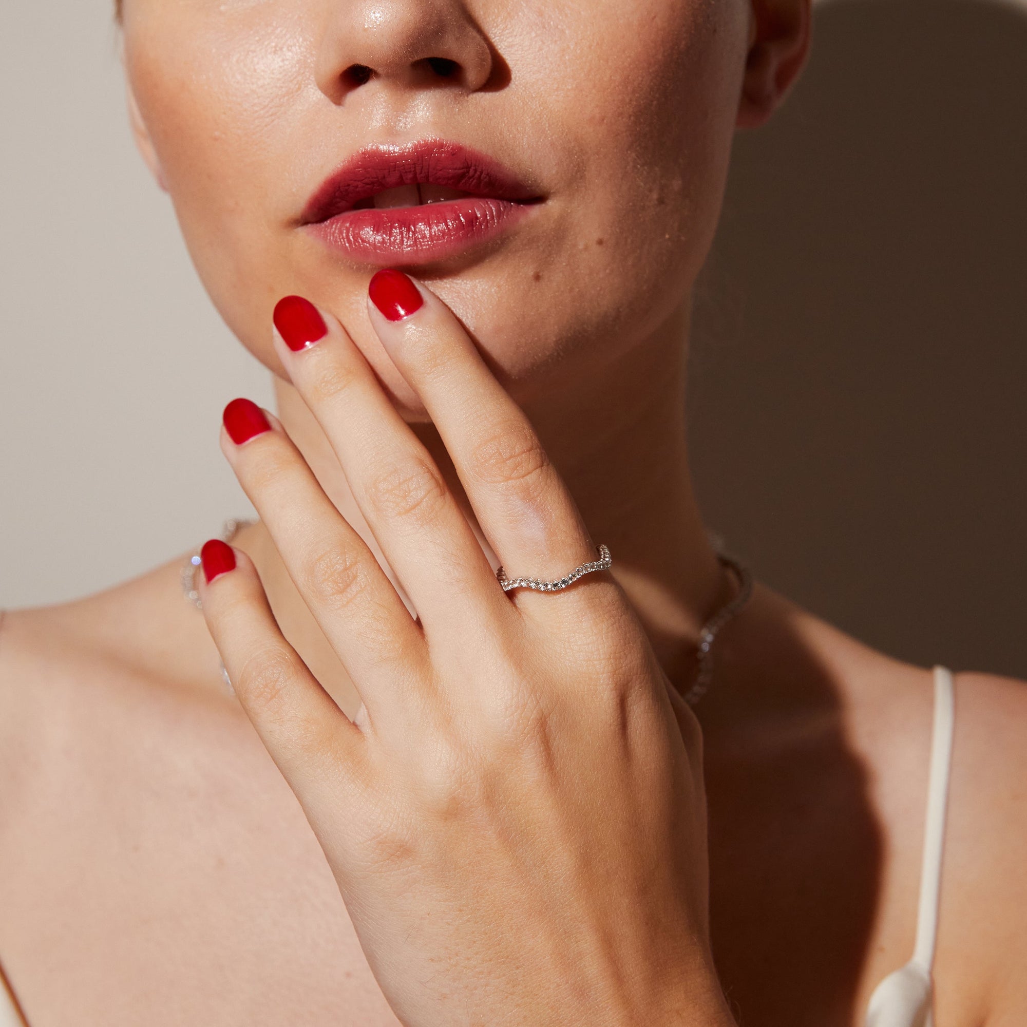 Close up of woman wearing gemstone ring