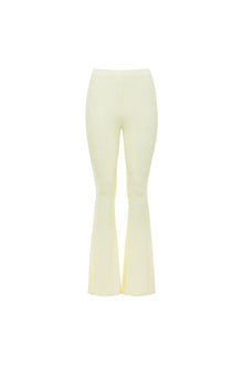 Cream ribbed flare pants with high waist and bell bottom legs.