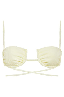 Cream-colored ribbed bikini top with underwire cups, thin shoulder straps, and cross-back tie closure.