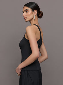 Model wears a black ribbed one shoulder tank.