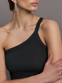 Model wears a black ribbed one shoulder tank.