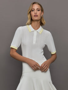 Model wears a lightweight and breathable polo tee shirt with yellow collar and sleeve details. 