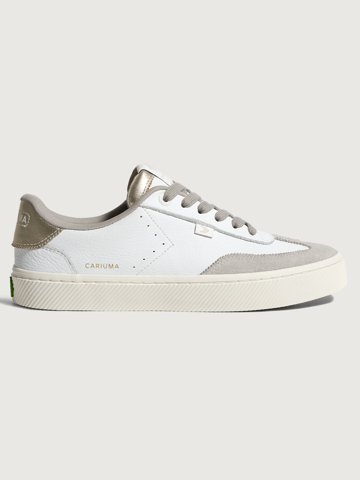 White and off-white colored sneakers with leather and suede materials, featuring a low-top design and lace-up closure.
