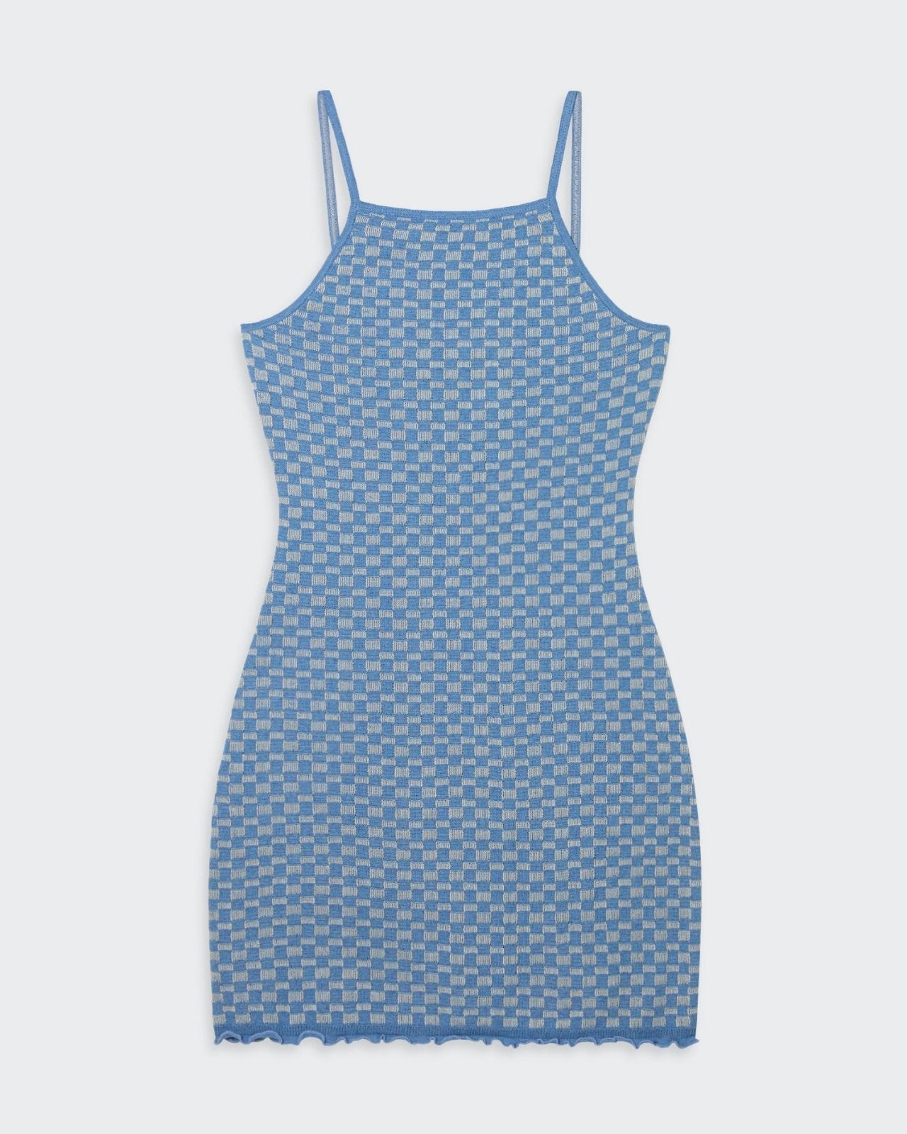 A woman's blue and cream colored checker pattern slip dress with spaghetti straps and a ruffle finish at the hem and cuffs.