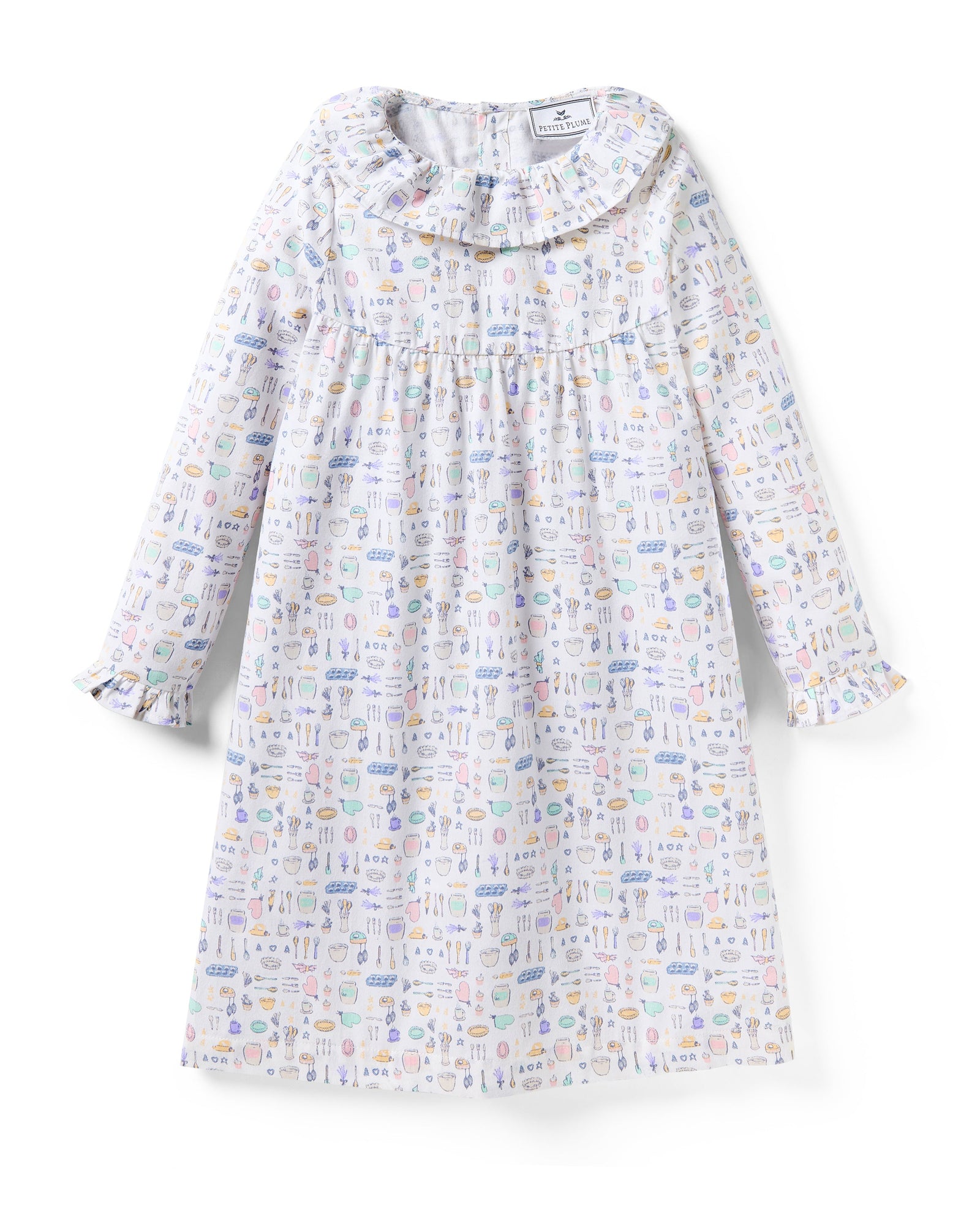 The Kid's Twill Scarlett Nightgown in Baking Spirits Bright features long sleeves, a ruffled collar and cuffs, and a pastel cupcake, teapot, and cutlery print on a white background.