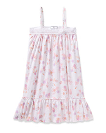 Enjoy the elegance of Petite Plumes Girls Twill Lily Nightgown in Seashell Splendor—a white sleeveless dress boasting pink and purple floral and fruit patterns, yarn-dyed cotton, a lacy trim top, and a ruffled hem for luxurious sleep.