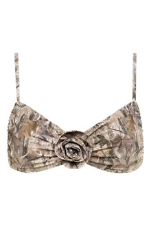 Camo bikini top with camouflage print in beige and brown tones, featuring thin shoulder straps and a decorative rosette detai