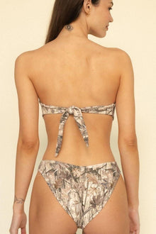 Camo print bikini bottom with zig-zag stitched edges and high-cut leg openings, shown from back view.