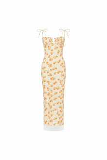 Cream slip dress with orange cherry print, sweetheart neckline, tie shoulders, and white lace trim at hem.