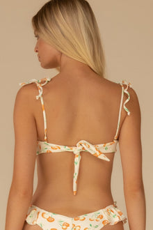 Bandeau bikini top with orange and green cherry print, tie-shoulder straps, and back tie closure.