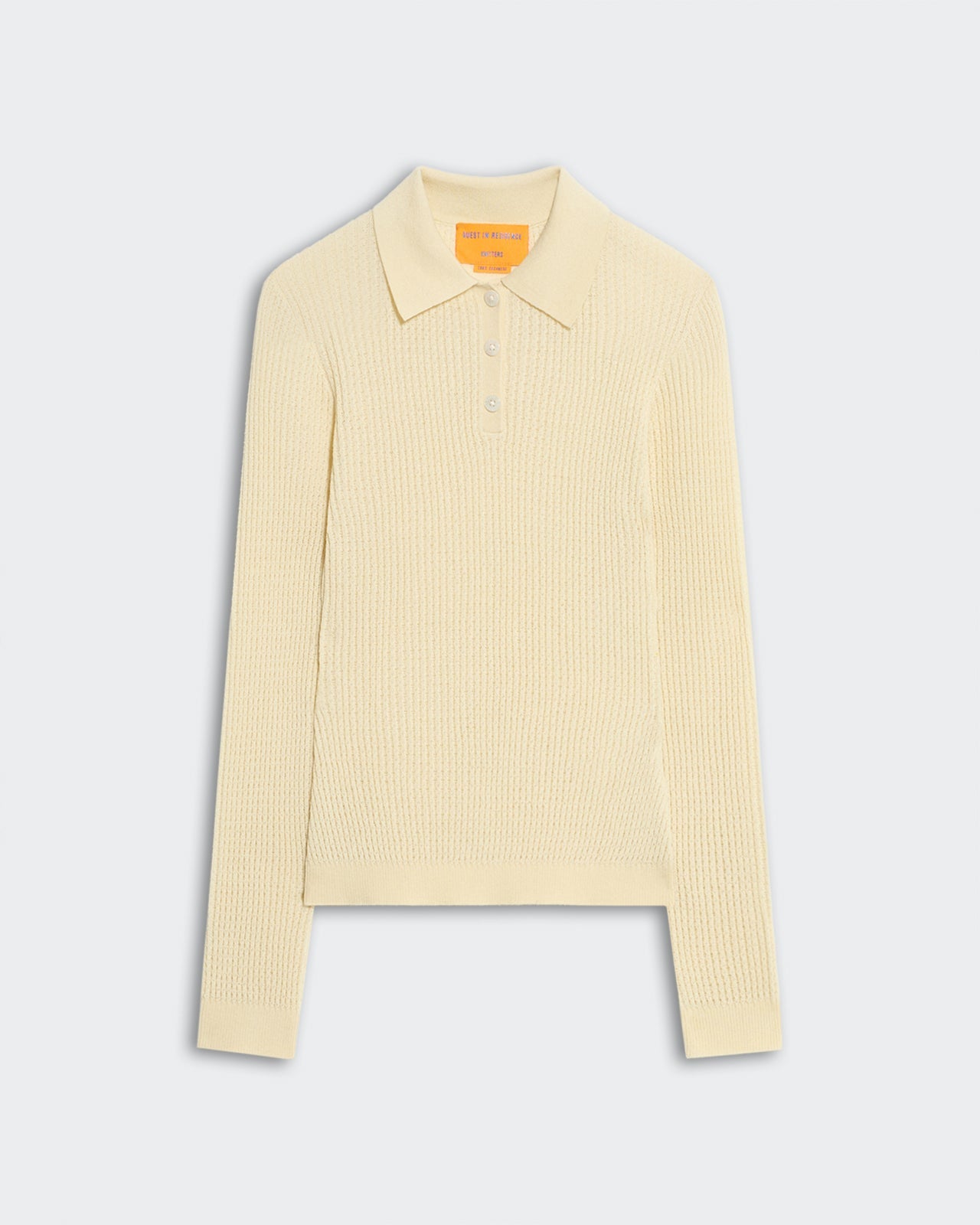 Lightweight women's long sleeve shrunken polo in mist color with waffle knit texture and ribbed collar and cuffs.