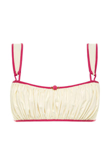 Cream bikini top with raspberry pink binding, gathered fabric, and adjustable shoulder straps with center rose detail.
