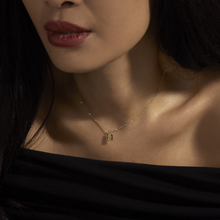 Image of 14K Yellow Gold Dainty Little Lock Necklace on Models Neck