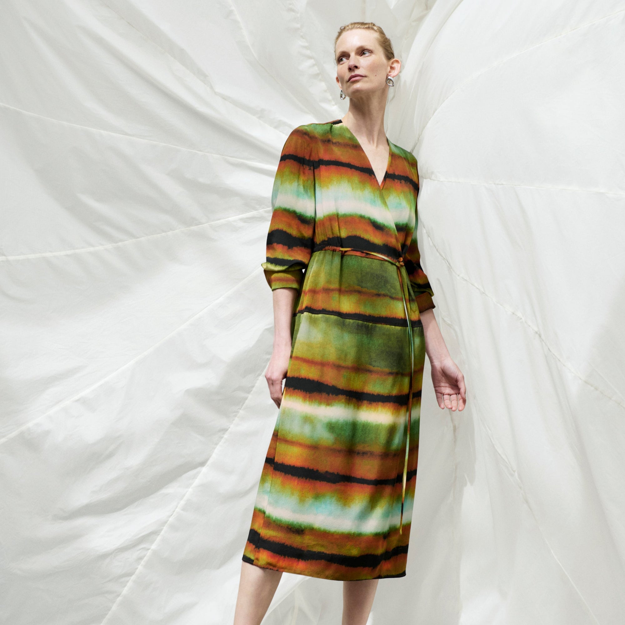 Front image of a woman wearing the Deana dress in Faded Print | Exclude