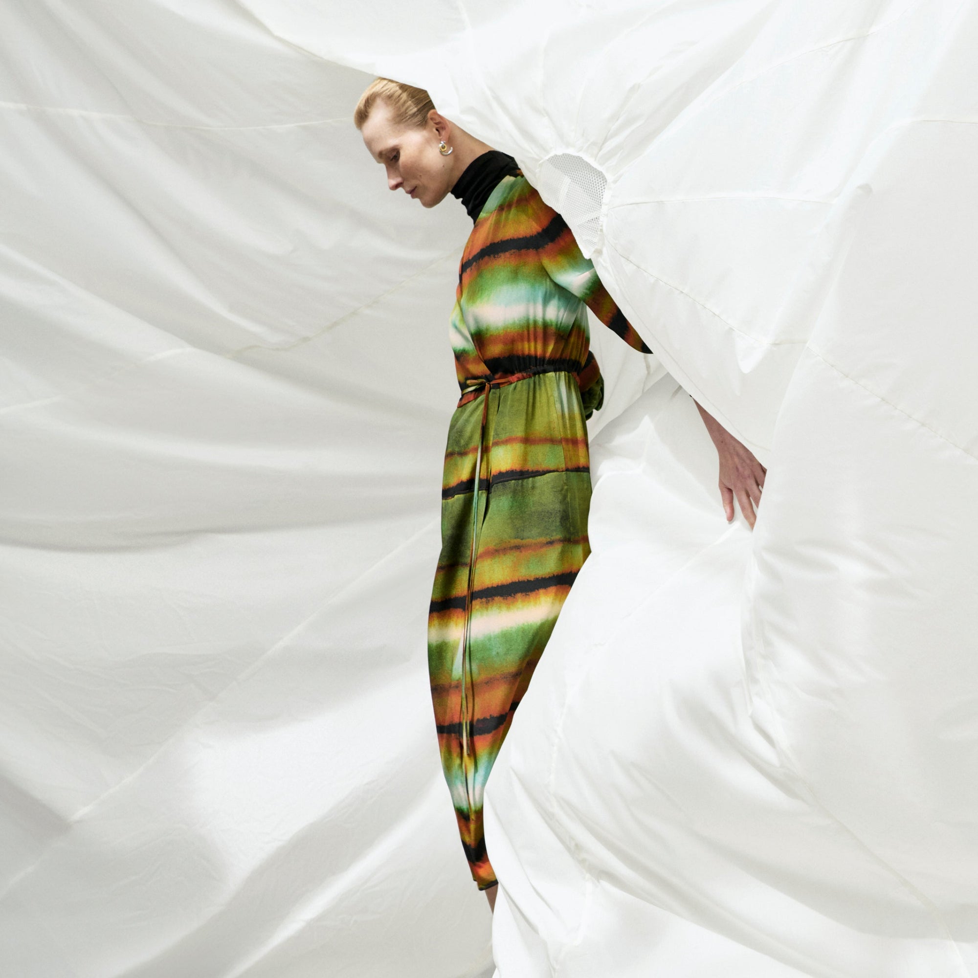 Front image of a woman wearing the Deana dress in Faded Print | Exclude