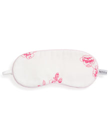 The Kids Sleep Mask in English Rose Floral by Petite Plume, featuring a white background and pink floral pattern, is perfect for memorable moments. Enhance the charm with matching eye masks for a coordinated look.