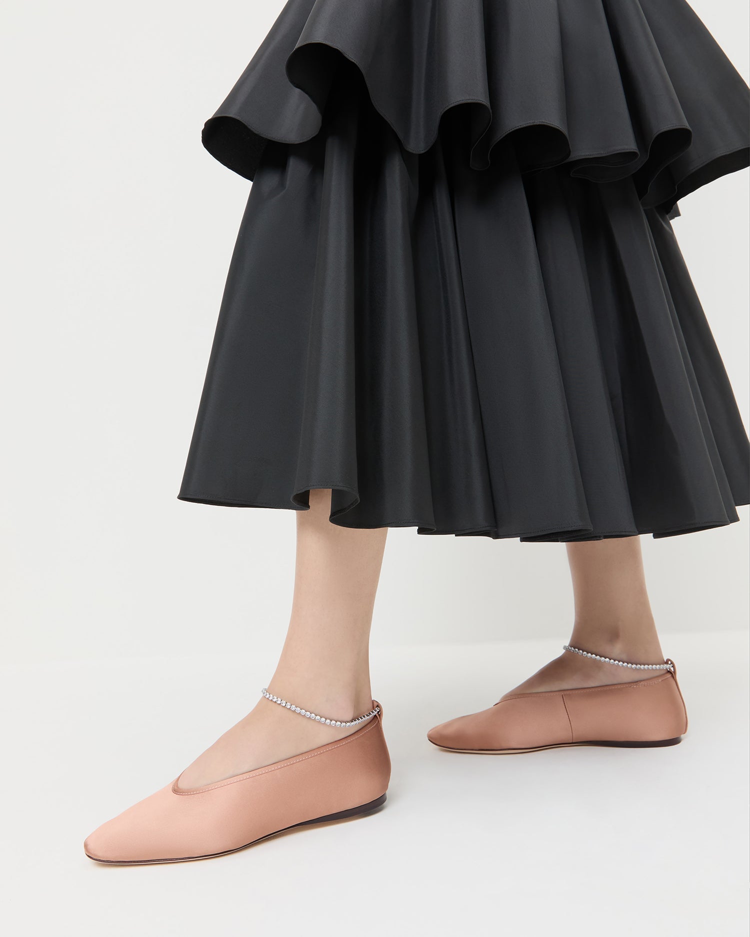 Emery Blush/Crystal Ballet Flat in blush pink satin with crystal accents and Sora Skirt in black taffeta.