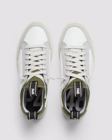 Front angle of white, grey and green sneakers