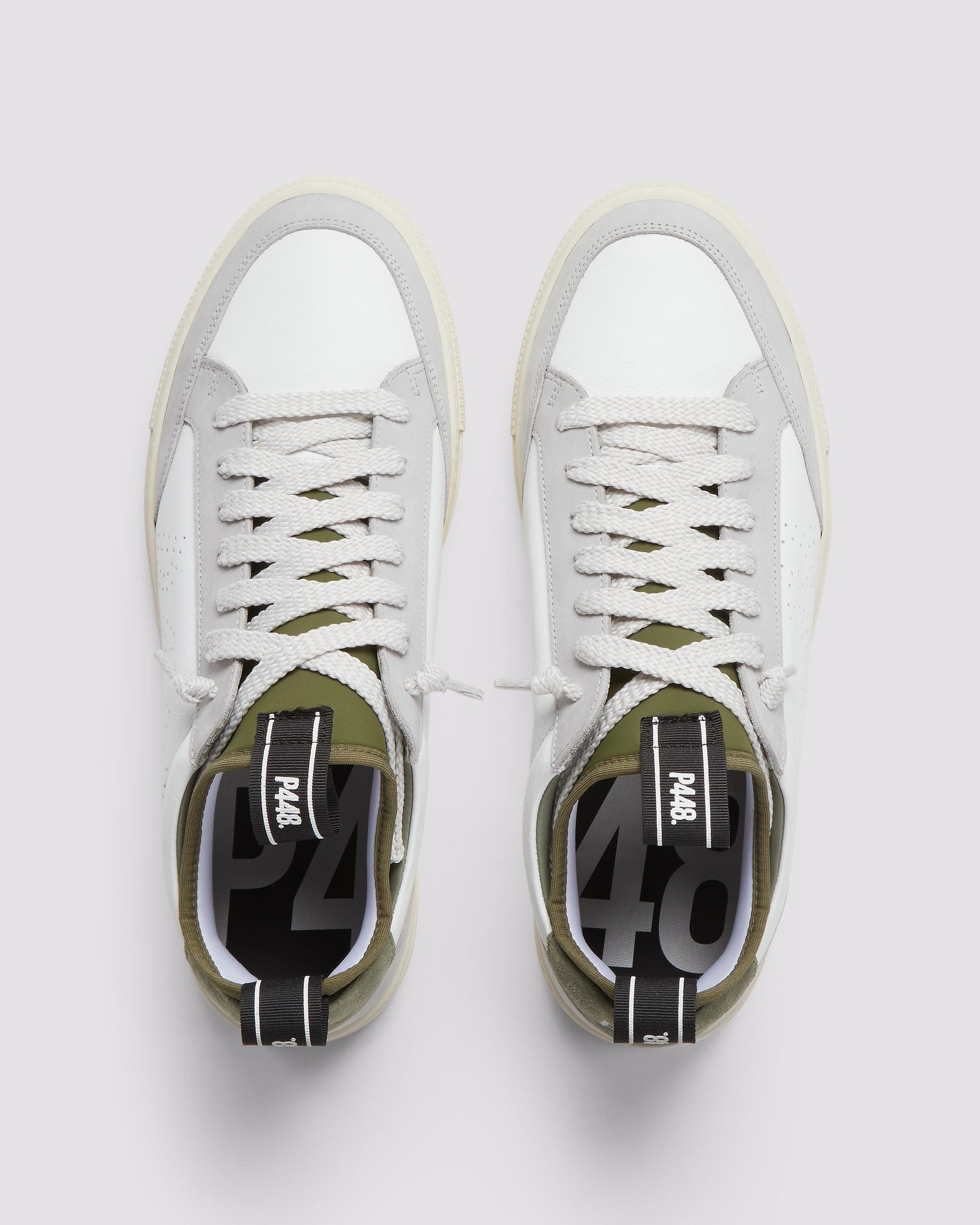 Front angle of white, grey and green sneakers