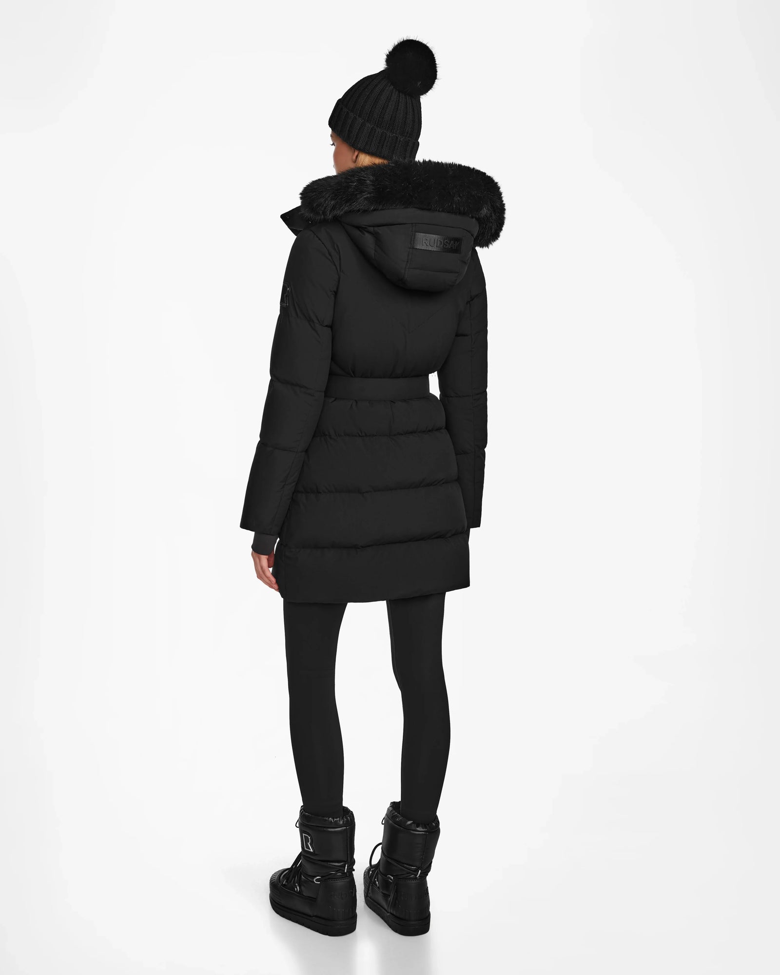 A person wearing the CHRISTEL M-M - L124505 Black coat by Rudsak stands against a plain white background, facing away from the camera.