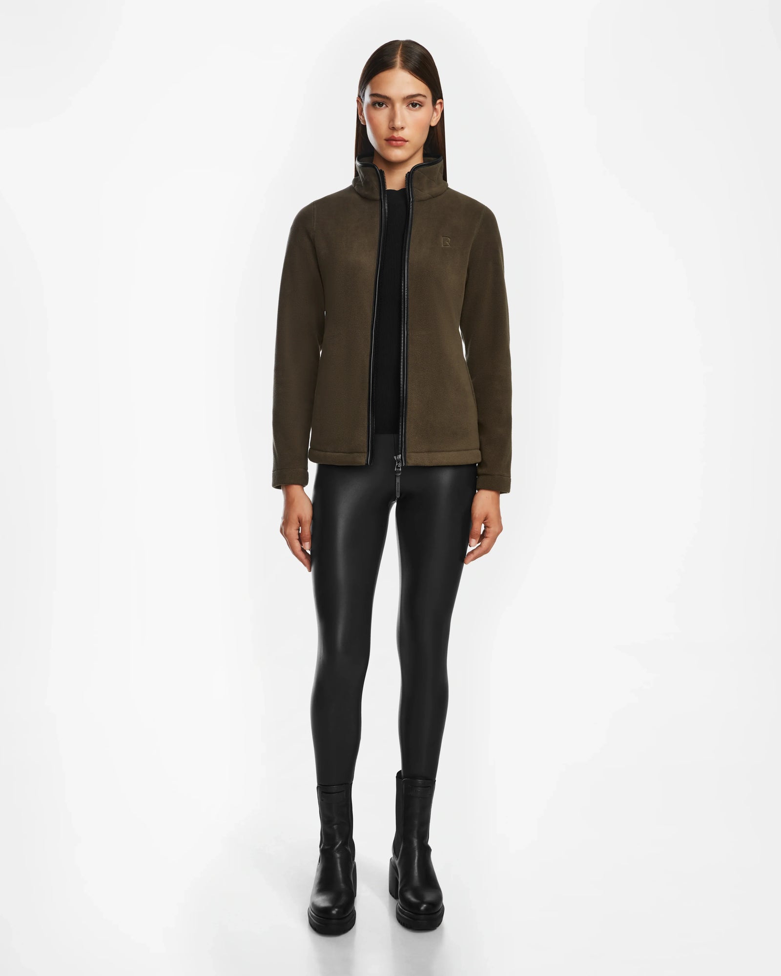 A woman wearing the EDITH - 8524617 Army sweater by Rudsak with brown vegan leather trim.