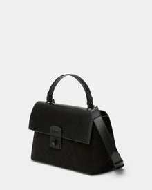 The Rudsak ESMA - 8324519 Black handbag features suede and leather, a top handle, removable wide adjustable strap, and a front flap with rectangular clasp, shown against a plain light background.