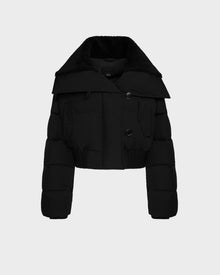 The Rudsak YVETTE - 8124710 Black is a chic women’s cropped puffer jacket with a large collar, two front buttons, flap chest pockets, and an elastic hem—perfect for stylish winter looks. Displayed on a plain light background.