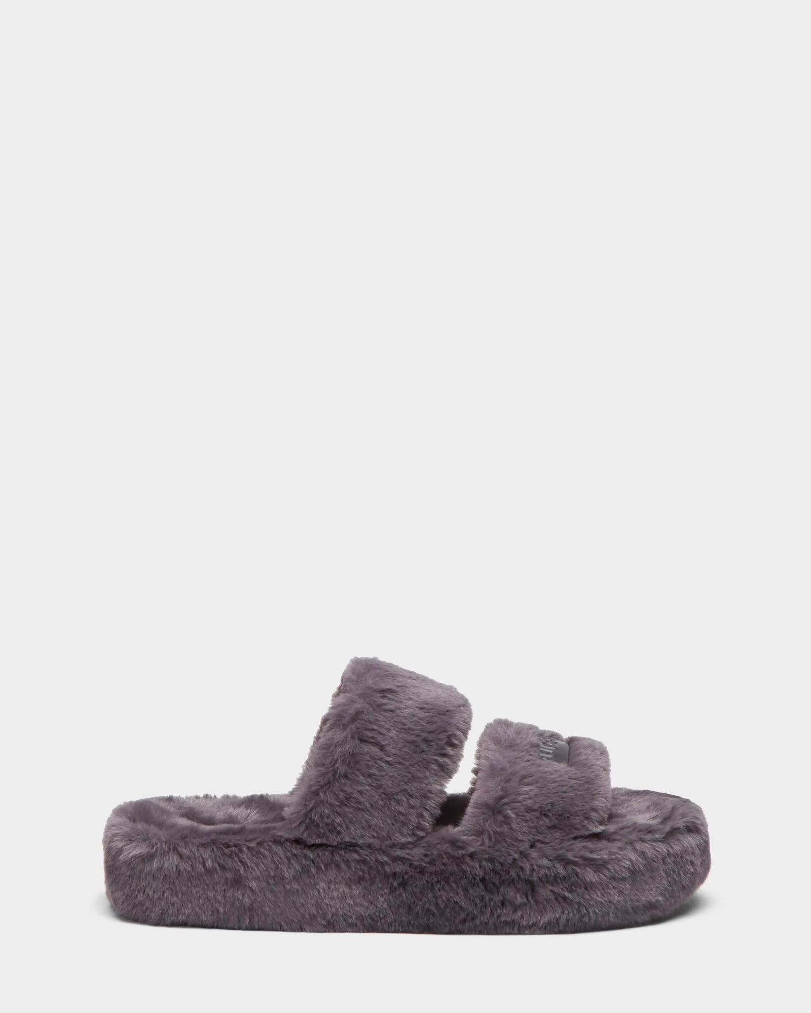 The ZETA - 8224508 Grey by Rudsak is a womens faux fur slipper featuring two thick, fuzzy straps and a plush sole, displayed in side profile on a plain white background.