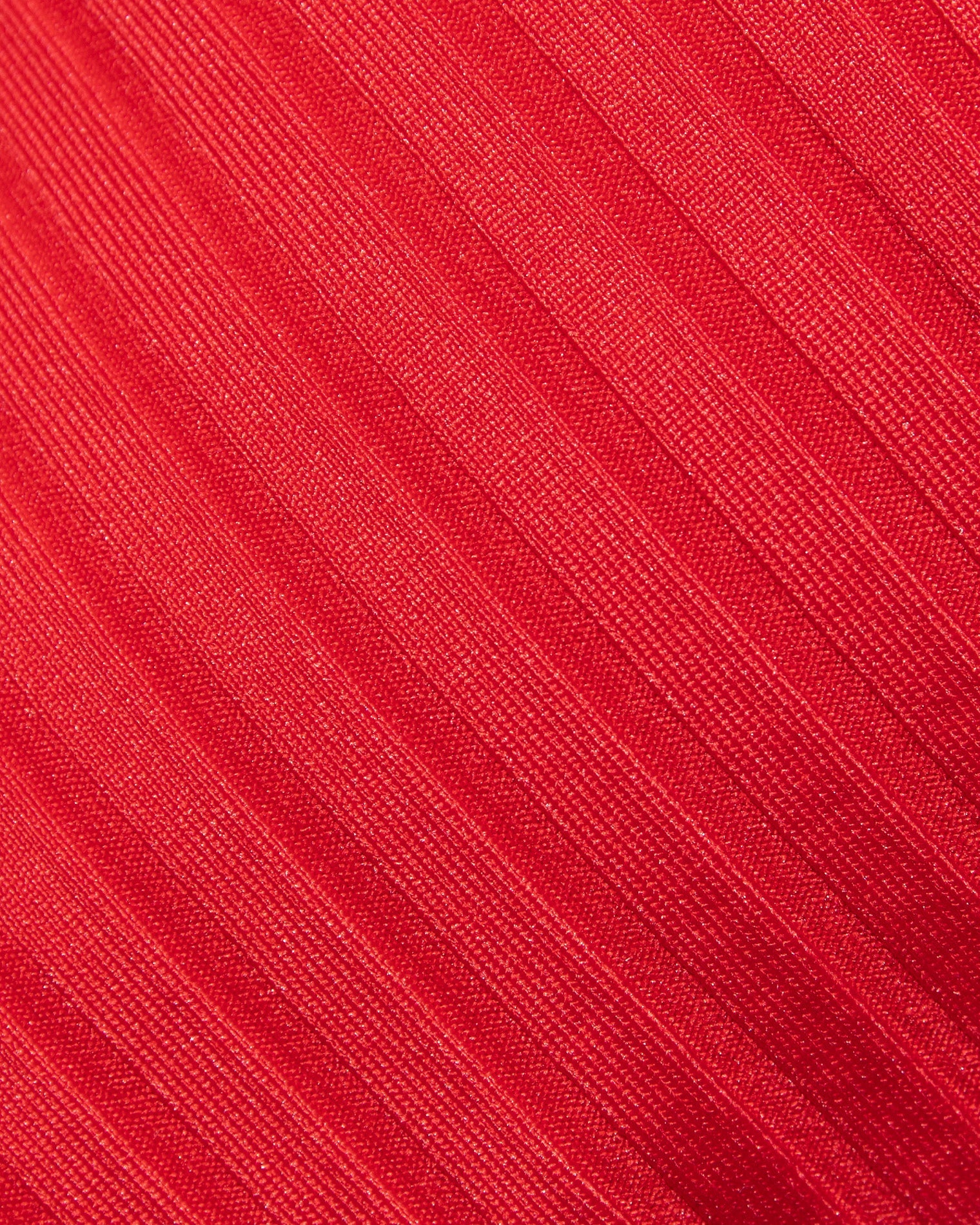 Close-up of red fabric with a textured pattern