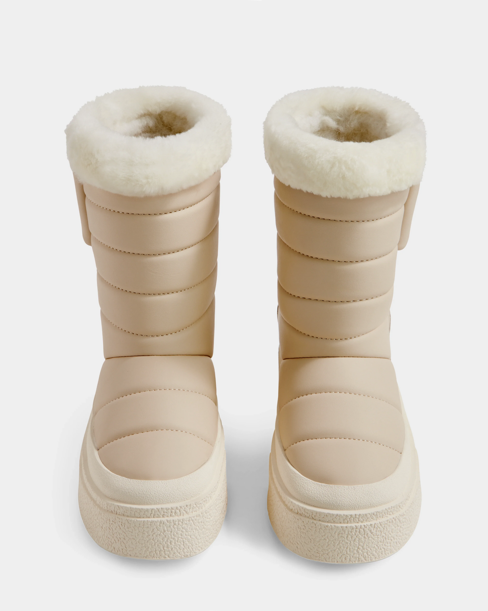 The Rudsak KATHIE - L225516 Vanilla are beige women's mid boots with quilted, padded sides and thick white faux fur lining at the top, shown from the front on a white background.