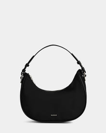 The Rudsak NIKKI - L325512 Black is a women’s crescent hobo shoulder bag with a short strap, silver zipper, and small front “RUDSAK” logo, shown against a plain light gray background.